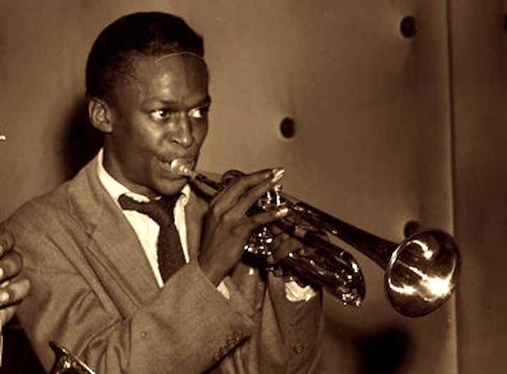 Miles Davis plays the trumpet